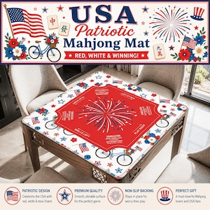 May include: A square mahjong mat featuring a white background with a repeating pattern of American flags, bicycles with flower baskets, and red, white, and blue flowers. The center has a red octagonal shape with a firework graphic and text.