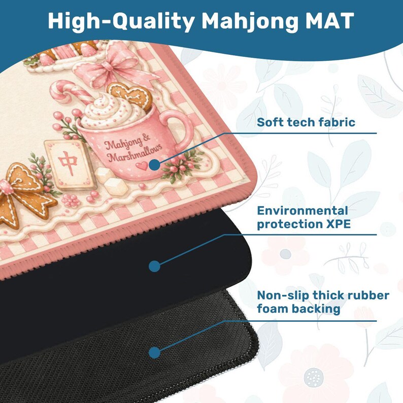 May include: A high-quality Mahjong mat with a pink and white design featuring a teacup with marshmallows and gingerbread cookies. The mat has a soft tech fabric, environmental protection XPE, and a non-slip thick rubber foam backing. The text "High-Quality Mahjong MAT" is at the top.