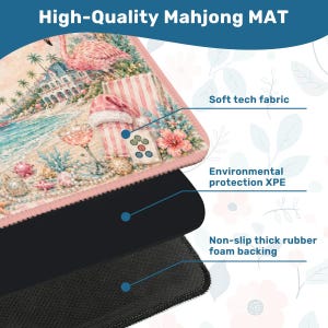 May include: A high-quality Mahjong mat with a beach-themed design featuring a flamingo, a building, and a cocktail glass. The mat has a soft tech fabric surface, environmental protection XPE, and a non-slip thick rubber foam backing.