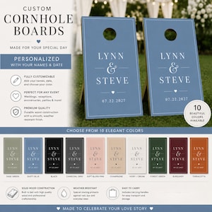 May include: Two dusty blue cornhole boards featuring white text that reads LYNN & STEVE and the date 07.22.2027. The boards have a circular hole at the top and a white border. A color chart displays ten different color options for the boards.
