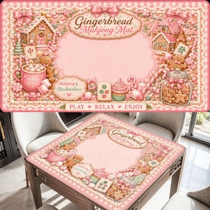 May include: A rectangular pink Mahjong mat featuring a gingerbread house theme with illustrations of gingerbread people, candy canes, a mug of marshmallows, and a jar of cookies. The text reads Gingerbread Mahjong Mat, Mahjong & Marshmallows, and PLAY RELAX ENJOY.