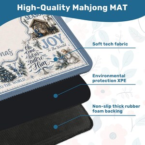 May include: A high-quality Mahjong mat with a Christmas-themed design. The mat features a blue border and a detailed illustration with text that reads "Oh come let us adore Him". It has a soft tech fabric, environmental protection XPE, and a non-slip thick rubber foam backing.