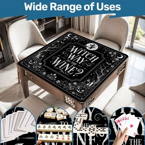 May include: A wooden table with a black surface featuring the text "Witch Way to the Wine?" surrounded by decorative illustrations. The image shows the table with playing cards, dominoes, and mahjong tiles, suggesting multiple uses.