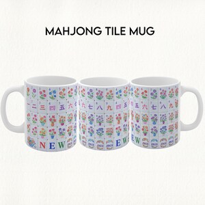 May include: Three white ceramic mugs with a Mahjong tile design. Each mug features a repeating pattern of colorful floral tiles with Chinese characters and numbers. The text "MAHJONG TILE MUG" is at the top, and the word "NEW" is at the bottom.