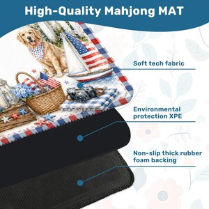 May include: A rectangular Mahjong mat featuring a patriotic illustration of a golden retriever, a sailboat, a picnic basket, and a camera. The mat is composed of a soft tech fabric top layer, an environmental protection XPE middle, and a thick rubber backing.