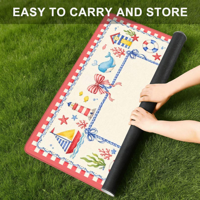 May include: A rolled-up, rectangular mat with a nautical theme, featuring a red and white border. The mat's design includes a lighthouse, sailboat, whale, and other sea-related illustrations. The text "EASY TO CARRY AND STORE" is visible at the top.