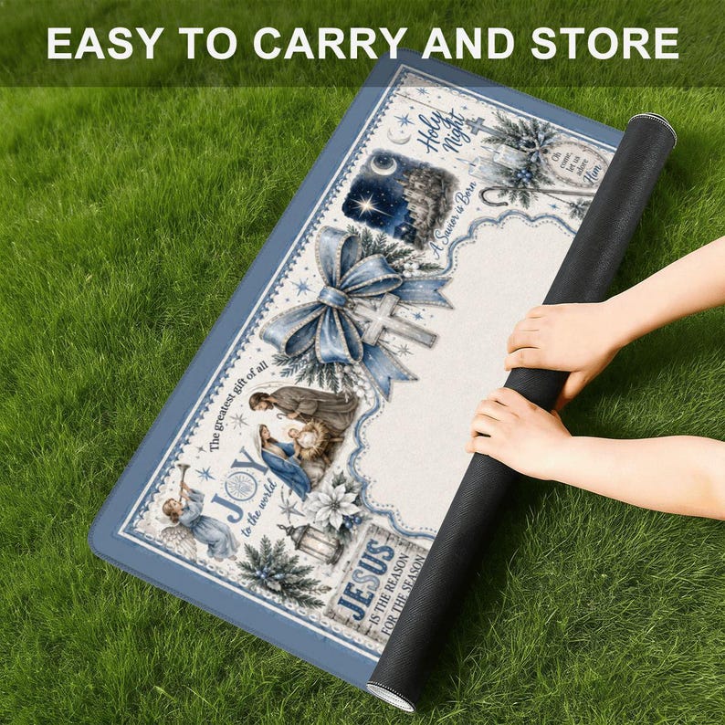 May include: A rolled-up rectangular mat with a blue border and a Christmas-themed design. The mat features illustrations of a nativity scene, a cross, and the text "JOY to the world" and "JESUS is the reason for the season". The text "EASY TO CARRY AND STORE" is at the top.