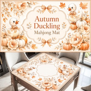 May include: A rectangular mahjong mat featuring a cream background with autumn-themed illustrations of ducklings, pumpkins, and flowers. The centre text reads Autumn Duckling Mahjong Mat, framed by orange and white checkered bows and floral accents.