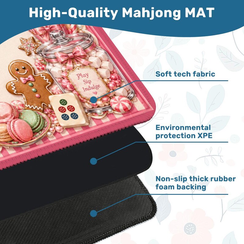 May include: A pink and white Mahjong mat with a candy and gingerbread theme. The mat features a gingerbread man, macarons, and a jar of sweets. The text "Play Sip Indulge" is on the mat. It has a soft tech fabric, environmental protection, and a non-slip rubber foam backing.