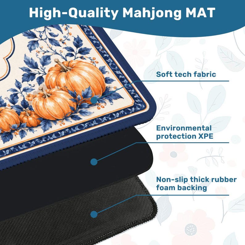 May include: A rectangular Mahjong mat featuring a cream-colored surface with orange pumpkins and blue foliage. The mat is composed of three layers: a soft tech fabric top, an environmental protection XPE middle layer, and a non-slip thick rubber foam backing.