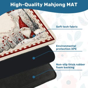 May include: A rectangular Mahjong mat featuring a winter scene with a gnome in a red hat, red berries, and snow. The mat is composed of three layers: a soft tech fabric top, an environmental protection XPE middle, and a non-slip thick rubber foam backing.