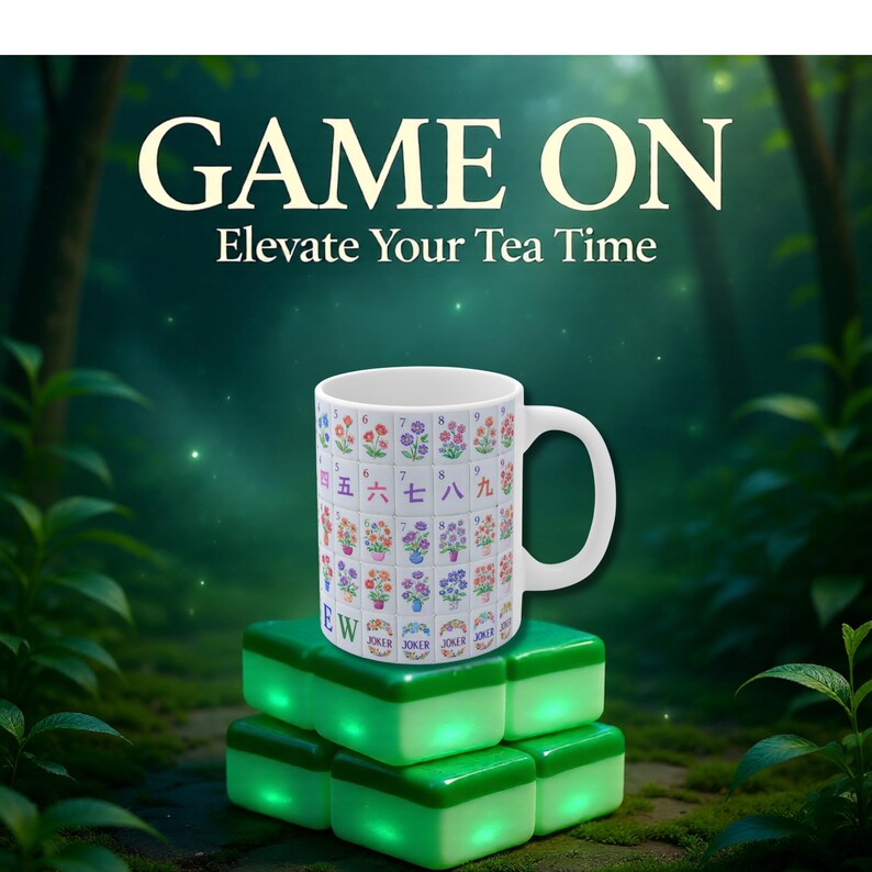 May include: White ceramic mug with a colorful floral and number design, resting on glowing green blocks. The mug features the text "GAME ON" and "Elevate Your Tea Time". The mug has a large handle.