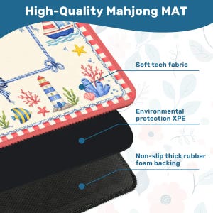 May include: A high-quality Mahjong mat with a nautical design featuring a lighthouse, boat, and marine life. The mat has a soft tech fabric surface, environmental protection XPE, and a non-slip thick rubber foam backing.