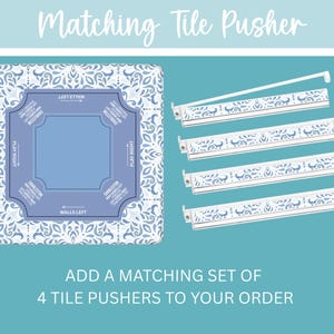 May include: A matching tile pusher set with a blue and white floral design. The set includes a square game board and four white tile pushers with decorative cutouts. Text on the board reads "Matching Tile Pusher".