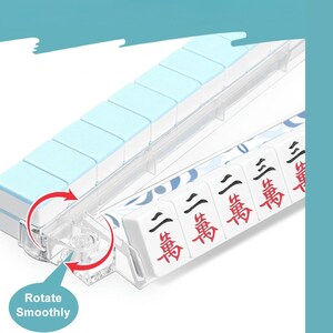 May include: A light blue and white Mahjong tile set with clear plastic components. The tiles are white with red and black characters. The image includes the text "Rotate Smoothly".