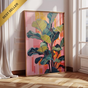 Könnte beinhalten: Gerahmter Kunstdruck mit einer stilisierten Geigenfeige. Das Kunstwerk zeigt große grüne und teal-farbene Blätter vor einem geometrischen Hintergrund in Rosa und Orange. Der Rahmen ist goldfarben, und ein "BEST SELLER" Banner befindet sich in der oberen linken Ecke.