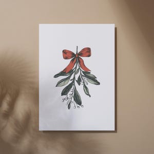 May include: A botanical illustration of mistletoe with a red bow. The artwork features green leaves, white berries, and a vibrant red bow at the top. The image is on a white background, perfect for holiday decor.