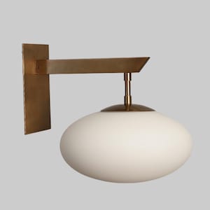 Mid Century Modern Wall Scones with Raw Brass Sputnik design, offering sleek, stylish lighting to enhance any space.