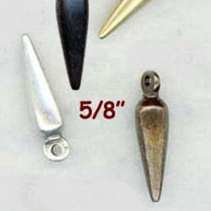 May include: Four metal pendant charms in different finishes: silver, black, gold, and bronze. Each charm is shaped like a pointed teardrop with a small loop at the top. The charms are 5/8 inches long.