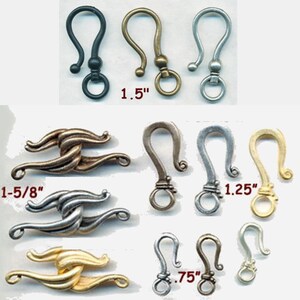 May include: Assortment of metal clasps in various sizes and finishes, including silver, gold, and black. The clasps are in the shape of a hook with a loop at the end. The sizes are labeled as 1-5/8 inches, 1.25 inches, 1.5 inches, and 0.75 inches.