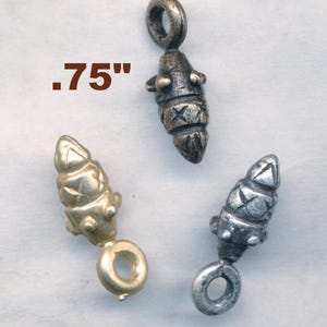 May include: Three metal pendant charms, each with a different finish: silver, gold, and antique silver. Each charm is shaped like a stylized cone with a loop at the bottom. The charms are .75 inches tall.