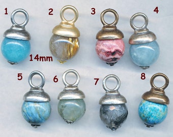 May include: Eight different 14mm gemstone pendants with silver, gold, and bronze accents. Each pendant features a different gemstone, including aquamarine, goldstone, rhodochrosite, and labradorite.