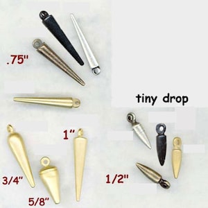 May include: Assortment of gold, silver, and black metal teardrop-shaped pendant charms in various sizes, including 3/4 inch, 5/8 inch, 1/2 inch, 1 inch, and .75 inch.  The charms have a pointed tip and a loop at the top for attaching to jewelry.