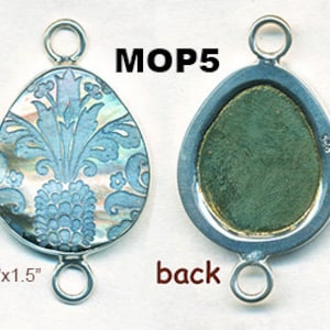 May include: A pair of silver-toned metal connector charms with a mother-of-pearl inlay. The inlay features a blue and white floral design. The charms are 1/8 inch by 1.5 inches.