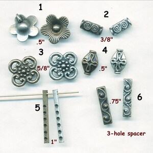 May include: Assortment of metal jewelry findings in silver and bronze tones.  Includes flower charms, spacers, and connector pieces.  Sizes range from 3/8 inch to 1 inch.