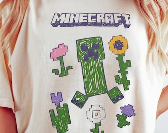 Camiseta con estampado de Creeper de Minecraft, merchandising para fans de los videojuegos.