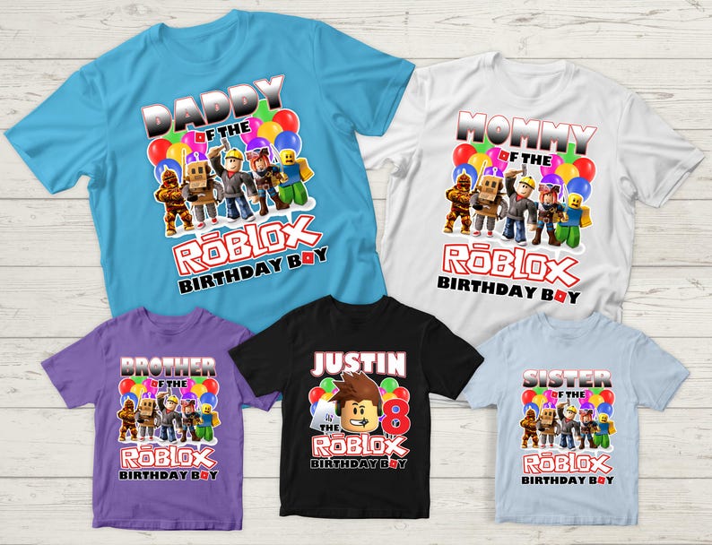 May include: Five t-shirts with different designs featuring the words "Daddy of the Roblox Birthday Boy", "Mommy of the Roblox Birthday Boy", "Brother of the Roblox Birthday Boy", "Sister of the Roblox Birthday Boy", and "Justin of the Roblox Birthday Boy".
