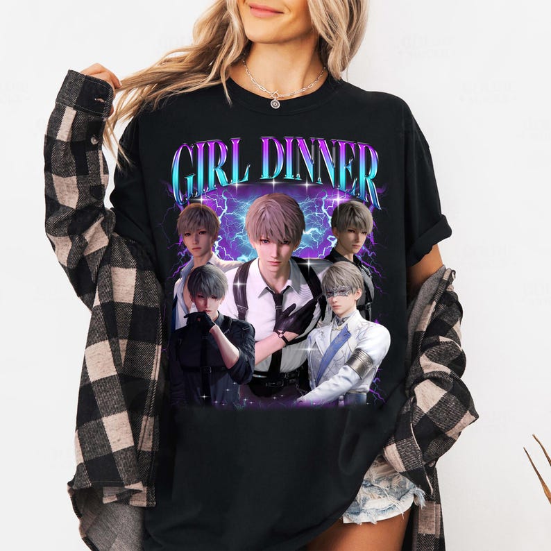 May include: Black t-shirt with a graphic print of five anime characters in a retro style. The text "GIRL DINNER" is printed in a colorful, stylized font above the characters.
