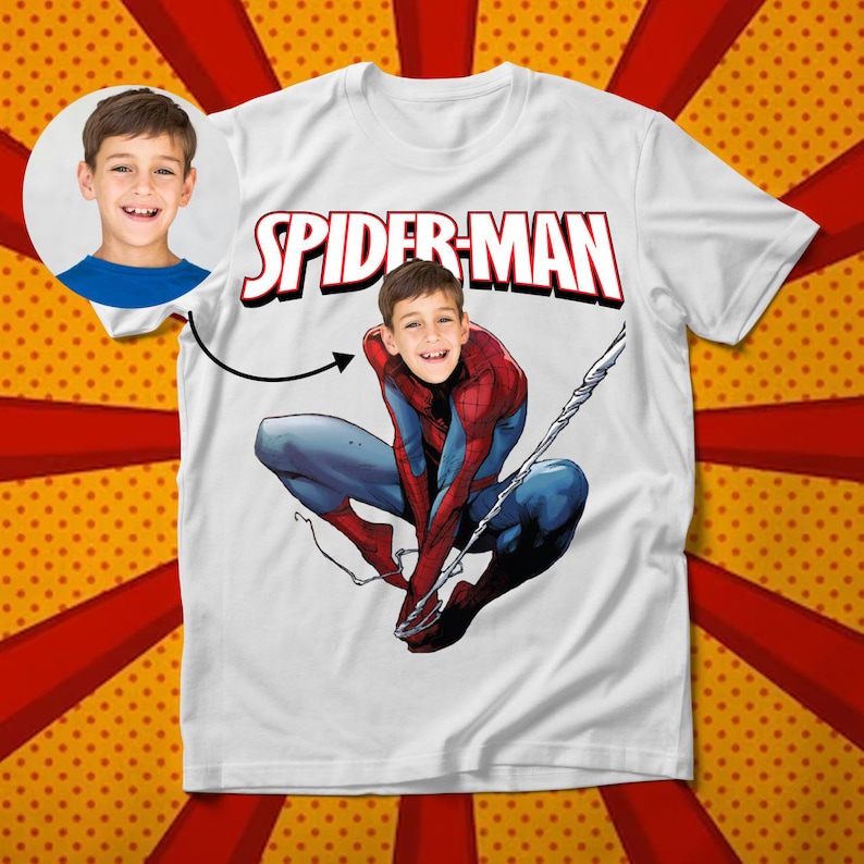 May include: White t-shirt with the words "Spider-Man" printed in red and a photo of a child's face superimposed on the face of Spider-Man.