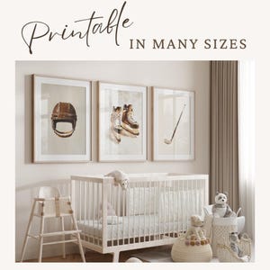 May include: Three framed prints of hockey equipment, including a helmet, a pair of skates, and a hockey stick. The prints are in a nursery setting with a crib, a high chair, and stuffed animals.
