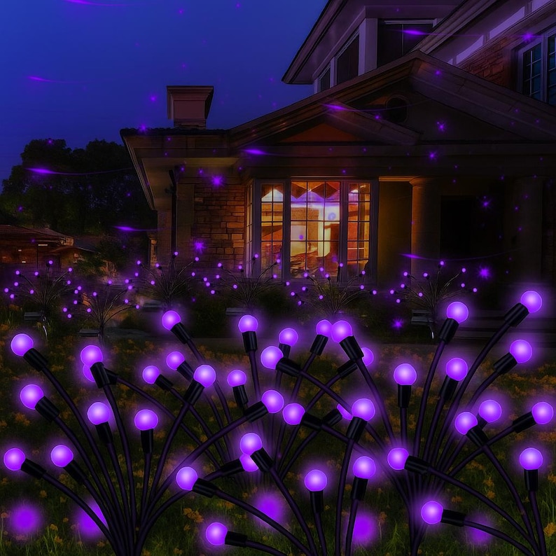 May include: A nighttime scene of a house with purple solar-powered garden lights. The lights have black stems and round, glowing purple bulbs. The lights are arranged in a garden bed in front of the house.