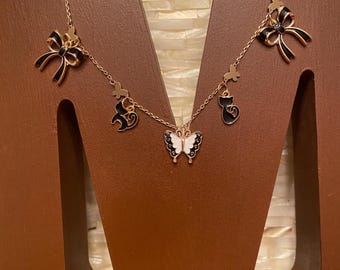 Black Cats, Butterflies, and Bows delicate gold tone charm necklace