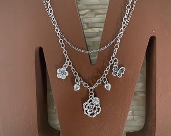 A Rose is a Rose layered silver tone charm necklace