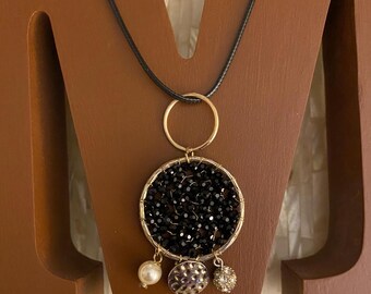 Black Beaded Sparkles vintage gold tone charm necklace designed with all vintage charms