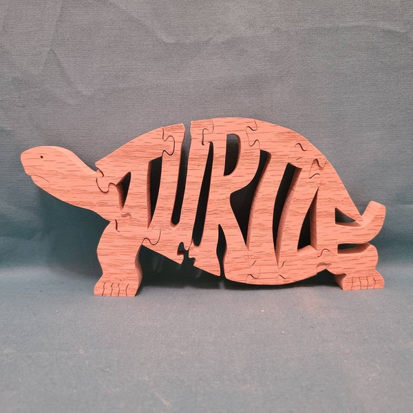 Turtle puzzle cut from oak or maple with a scroll saw,  hand crafted with turtle word cut into the puzzle