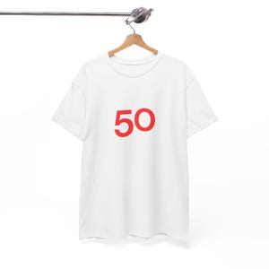 May include: White t-shirt with the number 50 printed in red on the front.