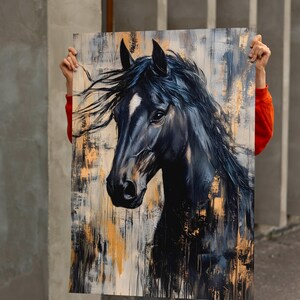 May include: A black horse portrait painting with a white blaze on its face. The artwork features a textured background with gold and grey brushstrokes. The horse's mane and forelock are flowing, adding a sense of movement.