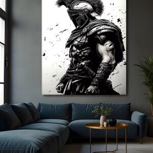 May include: Monochrome artwork depicting a Spartan warrior in full armour, including a helmet with a tall plume. The artwork is displayed on a large canvas, with black paint splatters on a white background. The warrior is muscular and stands in a powerful pose.