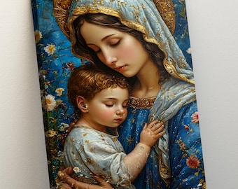 May include: A canvas print showing a mother and child in a close embrace. The mother is in a blue robe and veil with gold detailing, holding the child. The background is a vivid blue with floral elements, creating a peaceful and artistic scene.