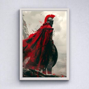 May include: Framed artwork depicting a Spartan warrior in a red cape and helmet, standing on a rocky outcrop. The artwork features a dramatic, painterly style with splashes of red and a cloudy sky background. The warrior holds a shield.