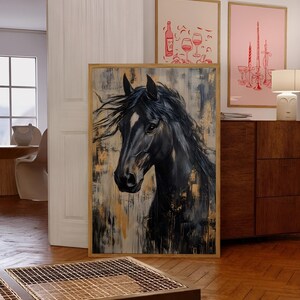 May include: A framed painting depicting a black horse with a white marking on its face. The artwork has a textured background with gold and beige hues. The horse's mane is flowing. The painting is displayed on a wooden floor.