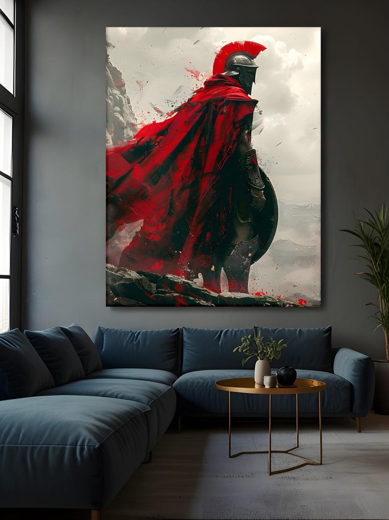 May include: A large canvas print depicts a Spartan warrior in full armor, standing on a rocky cliff. The warrior wears a red cape and helmet, holding a shield. The background features a cloudy sky and mountains.