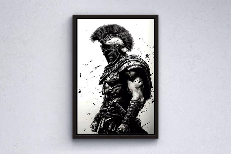 May include: Framed black and white artwork depicting a Spartan warrior. The illustration shows a detailed image of the warrior in full armour, including a helmet with a feathered crest and a sword. Splatter effects add a dynamic touch.