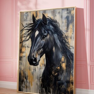 May include: An abstract painting of a black horse's head and neck, with a white blaze on its face. The artwork features a gold and neutral colour palette, with visible brushstrokes and a gold frame. The painting is displayed against a pink wall.