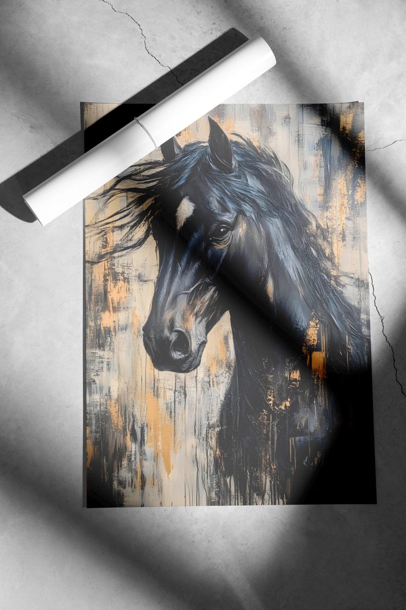 May include: An artistic print of a black horse's head with flowing mane. The artwork features a textured background with gold and neutral tones. A rolled-up white poster is placed on top of the print.