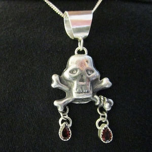 Skull and Cross Bones With Garnets Sterling Silver